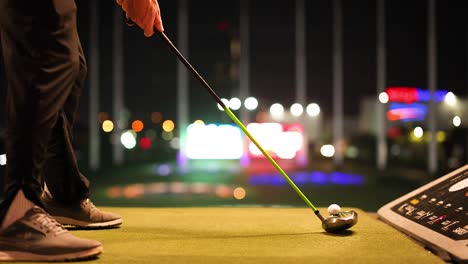 golfer preparing to swing at driving range