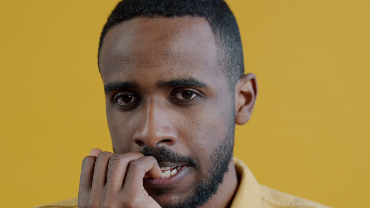 Worried Man Biting Nails