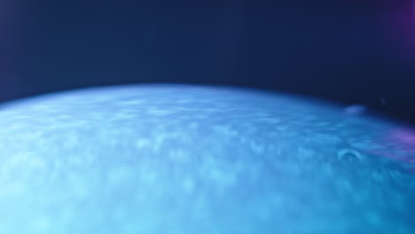 vibrant blue liquid mixing in a mesmerizing swirling motion, captured in a macro view