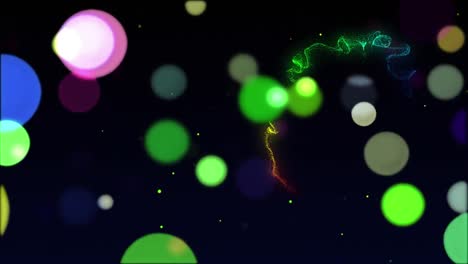 animación de manchas multicolores brillantes sobre el rastro de luz del arco iris en el fondo
