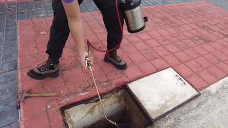 mexican fumigation company working on cockroach extermination at front yard of client house