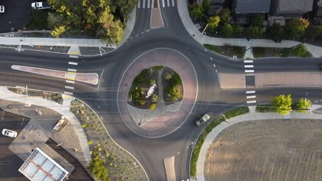 rising shot of rotunda, or roundabout, in bend, oregon with cars circling