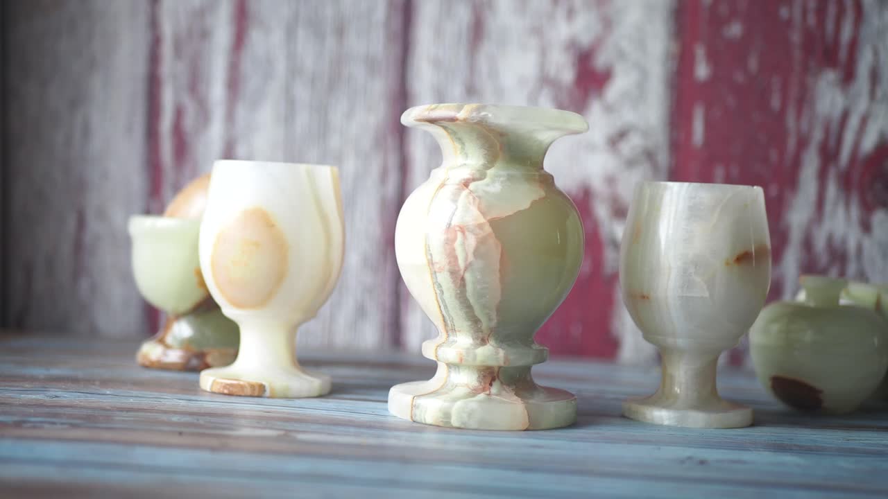 Onyx Vases and Cups on a Wooden Table