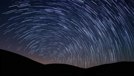 star trails over mountains