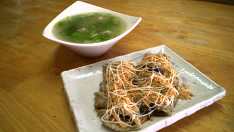 Asian-soup-and-pancake-dish-on-a-table