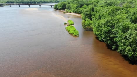 a slow coast along the edge of the forest and a river