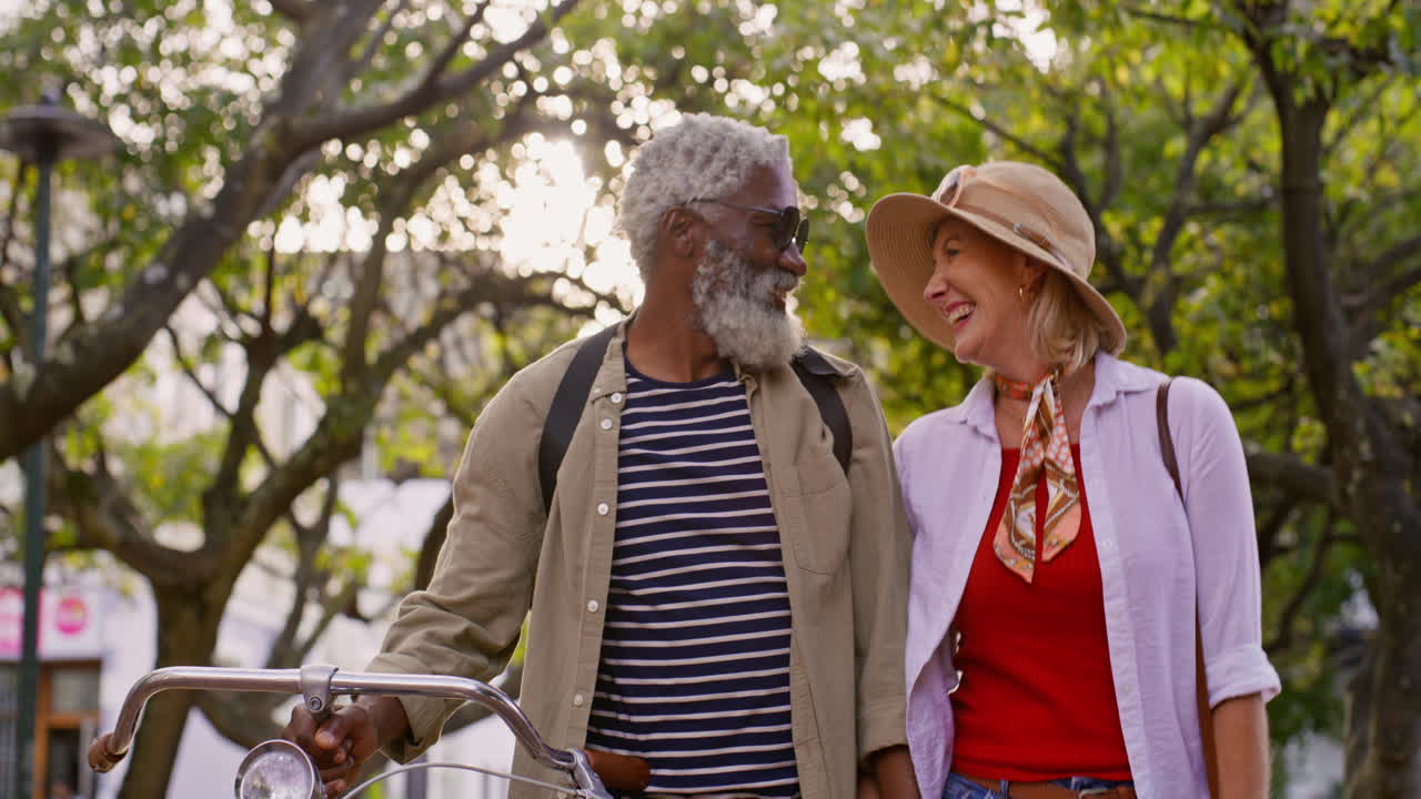 An elderly couple enjoying a bike ride together