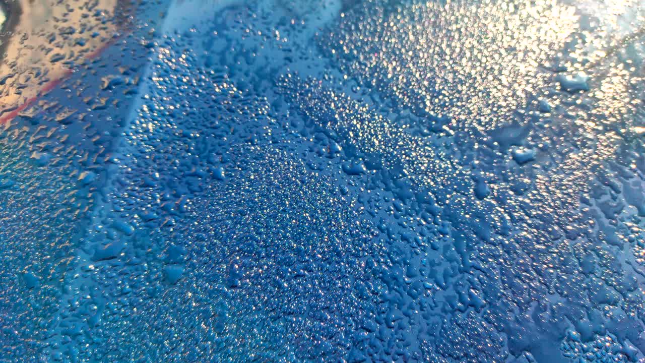 Water rain drops or water drops on blue background.