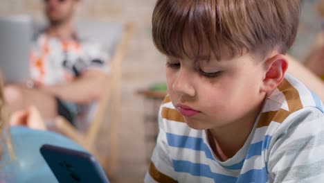 Close-up-video-of-boy-using-a-mobile-phone