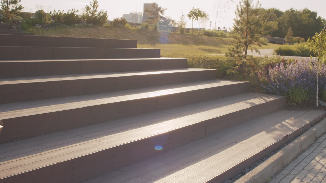 Young Man Setting Up E-Scooter with Smartphone