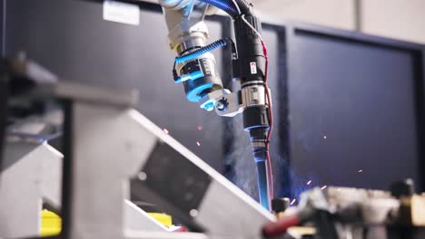 hero-close-up-shot-of-the-arm-of-an-automated-welding-machine,-during-work