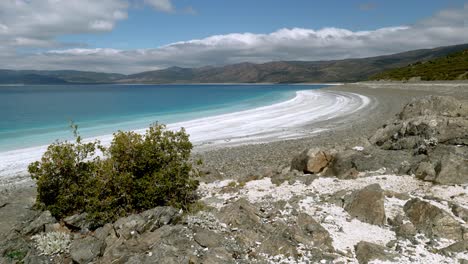Scenic view to Turkish hills over deserted white beach and turquoise Lake