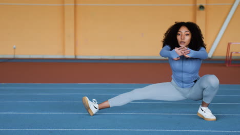 woman stretching indoors