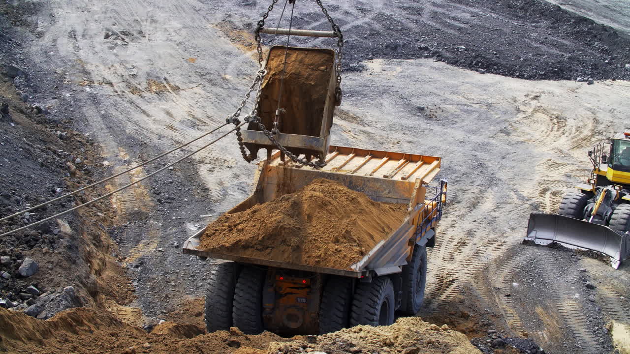 Dump Truck Loading in an Open-Pit Mine