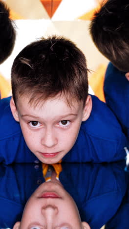 child in a kaleidoscope tunnel. glance into infinity. museum of science vertical video