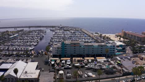 Wide-panning-aerial-shot-of-the-residential-apartments-at-King-Harbor-Marina-in-Redondo-Beach,-California