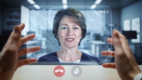 a professional video call experience: engaging with a smiling woman as she communicates effectively on a transparent screen in a modern office environment
