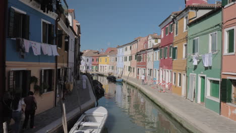 colourful houses and canal in burano island italy