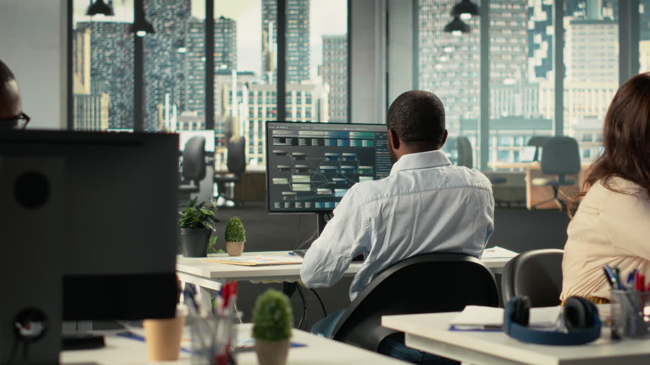 Vertical Video Diverse coworkers in office working on analytics and forecasting