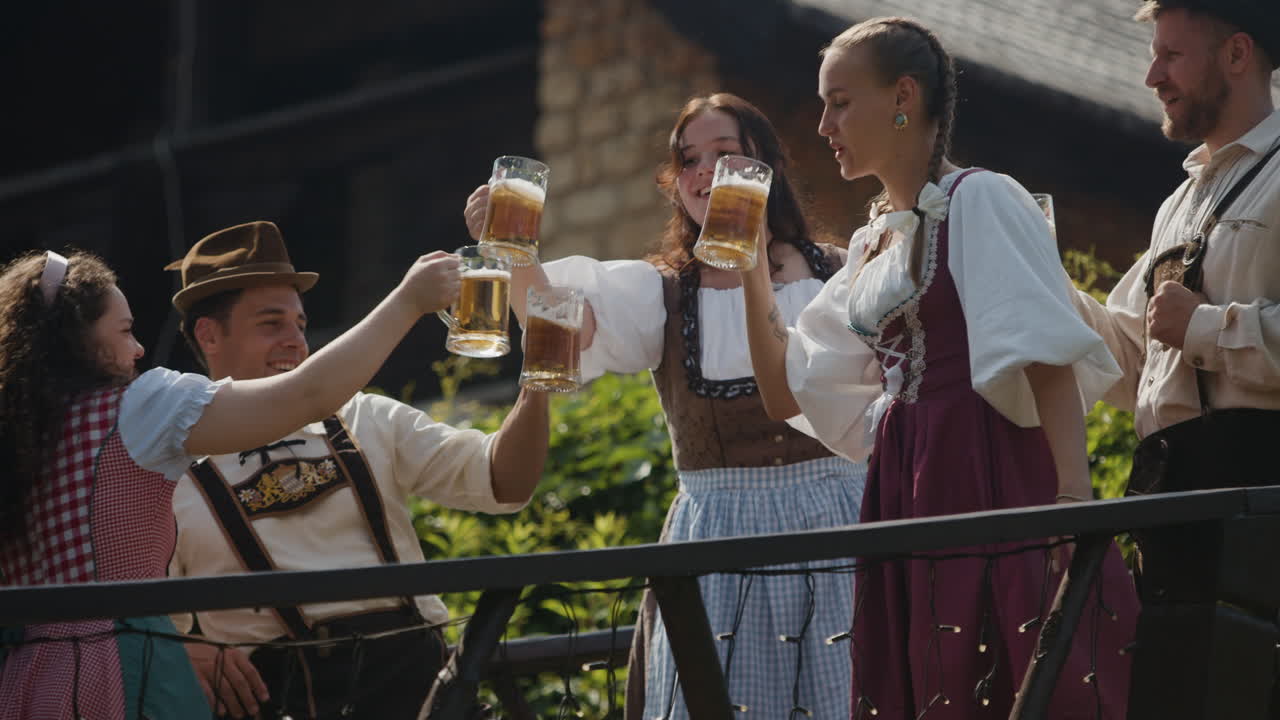 People in traditional clothing celebrating with beer