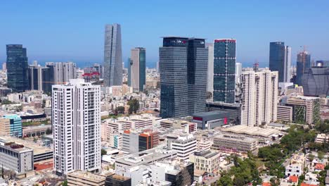 aerial view of tel aviv cityscape with modern skyscrapers and the mediterranean sea