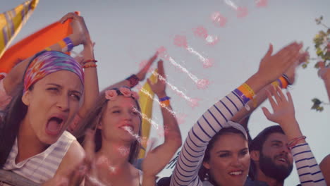 dna structure spinning against group of people clapping together at a concert