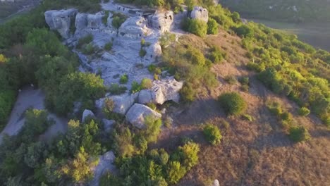 aerial view of ancient caves in a mountainous landscape