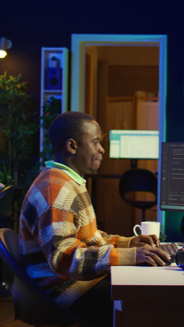 Vertical Video Professional male developer manages neural network at desk