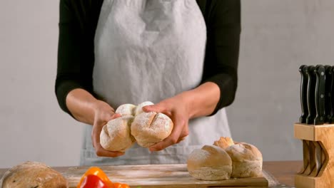 woman holding loaf of bread 4k