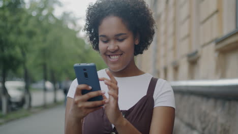 young woman texting on smartphone