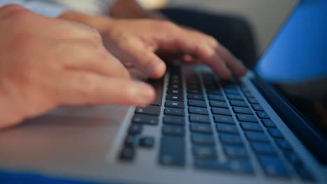 slowmotion-Hand-using-a-trackpad-computer-outdoors