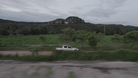 Vehicle-Traveling-In-The-Countryside-Of-Colombia---aerial-drone-shot