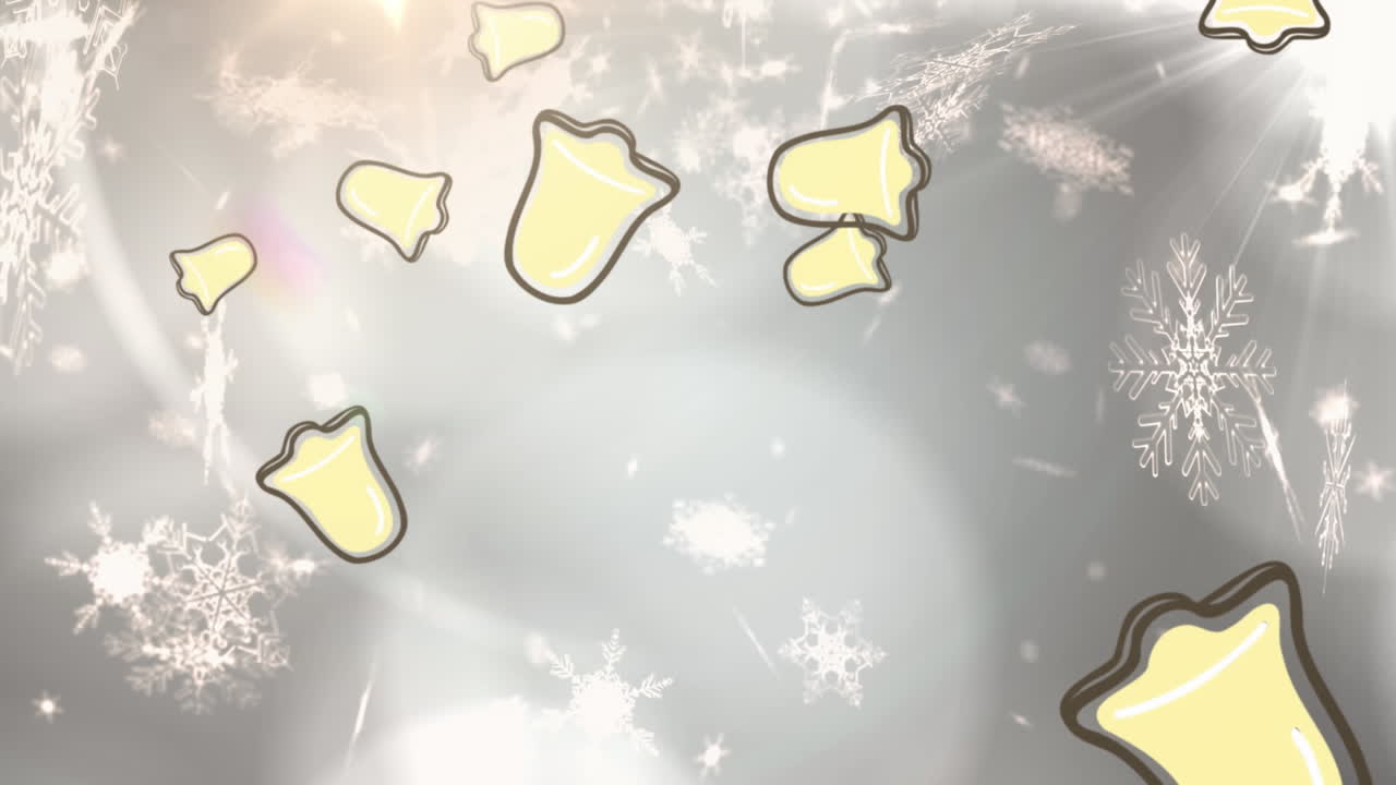 크리스마스 벨과 스노우플레이크 아이콘의 애니메이션은 회색 배경에 빛의 반점 위에 떨어집니다.