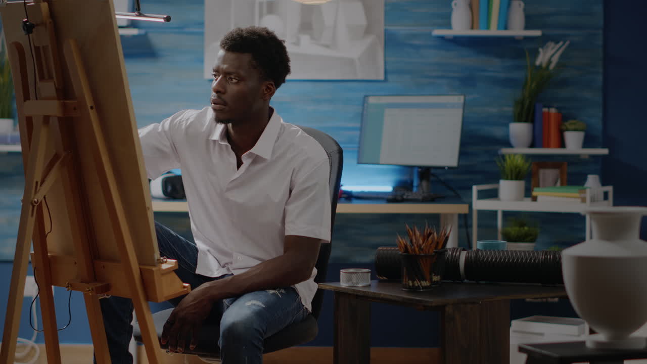 African american young adult using art tools for drawing