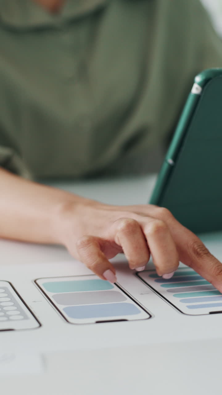 Person's Hand Tapping on Mobile App Design Mockups and Tablet