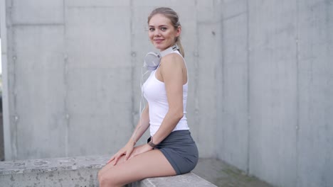 young woman sitting outdoors