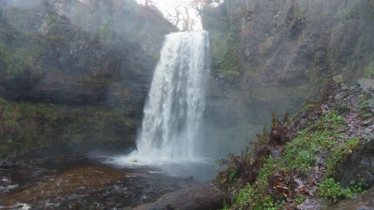 Incredible Waterfall Crashing Down onto River Below and Spraying Camera Lens 4K