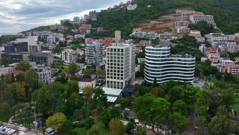 apartments and hotel buildings at budva city coast - aerial drone view