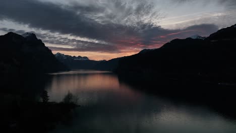 Sunrise-over-Lake-Walen-and-Wessen-Cliffs,-Switzerland-aerial-view