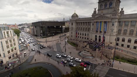 car traffic in front of czech national museum in prague, wide panorama