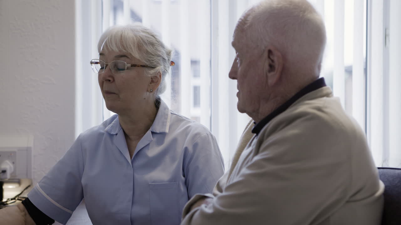 Nurse caring for elderly patient