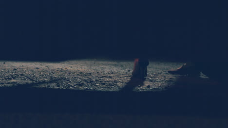 image of a couple feet getting off the car during evening. - close up, slow motion