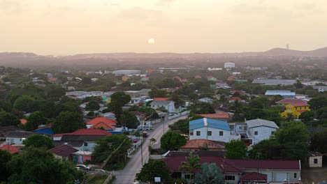 Haze-clouds-cover-setting-sun-over-tropical-Caribbean-neighborhood