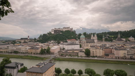 time-lapse of salzburg, austria. shot from across the river to hohensalzburg fortress. fast moving clouds