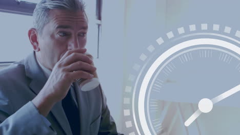 Animation-of-clock-ticking-over-caucasian-businessman-drinking-tea