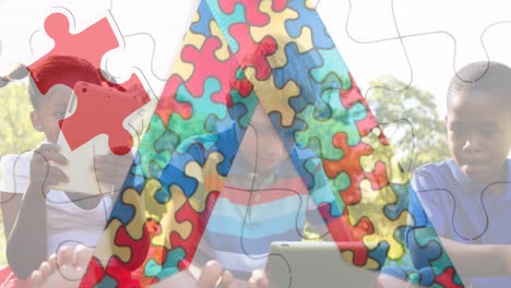 Animation-of-colourful-puzzle-pieces-ribbon-over-school-children-using-tablets