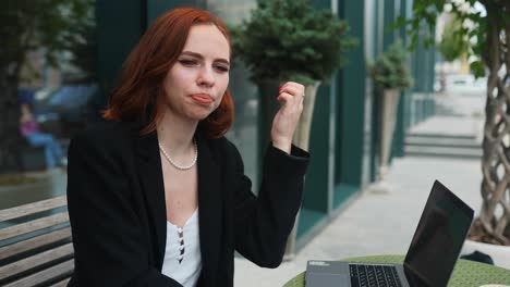 businesswoman working outdoors in a cafe