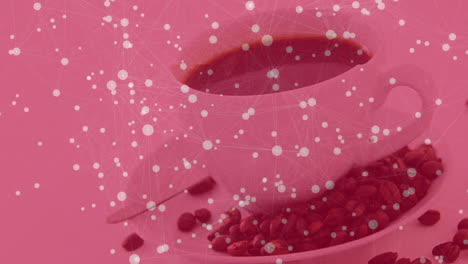 white ceramic coffee cup pouring dark brew while network nodes connecting over pink backdrop