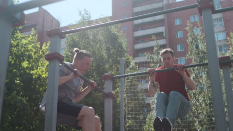 men doing pull ups outdoor