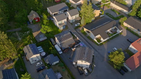 aerial: photovoltaic cell roofs absorbing solar energy for suburban houses